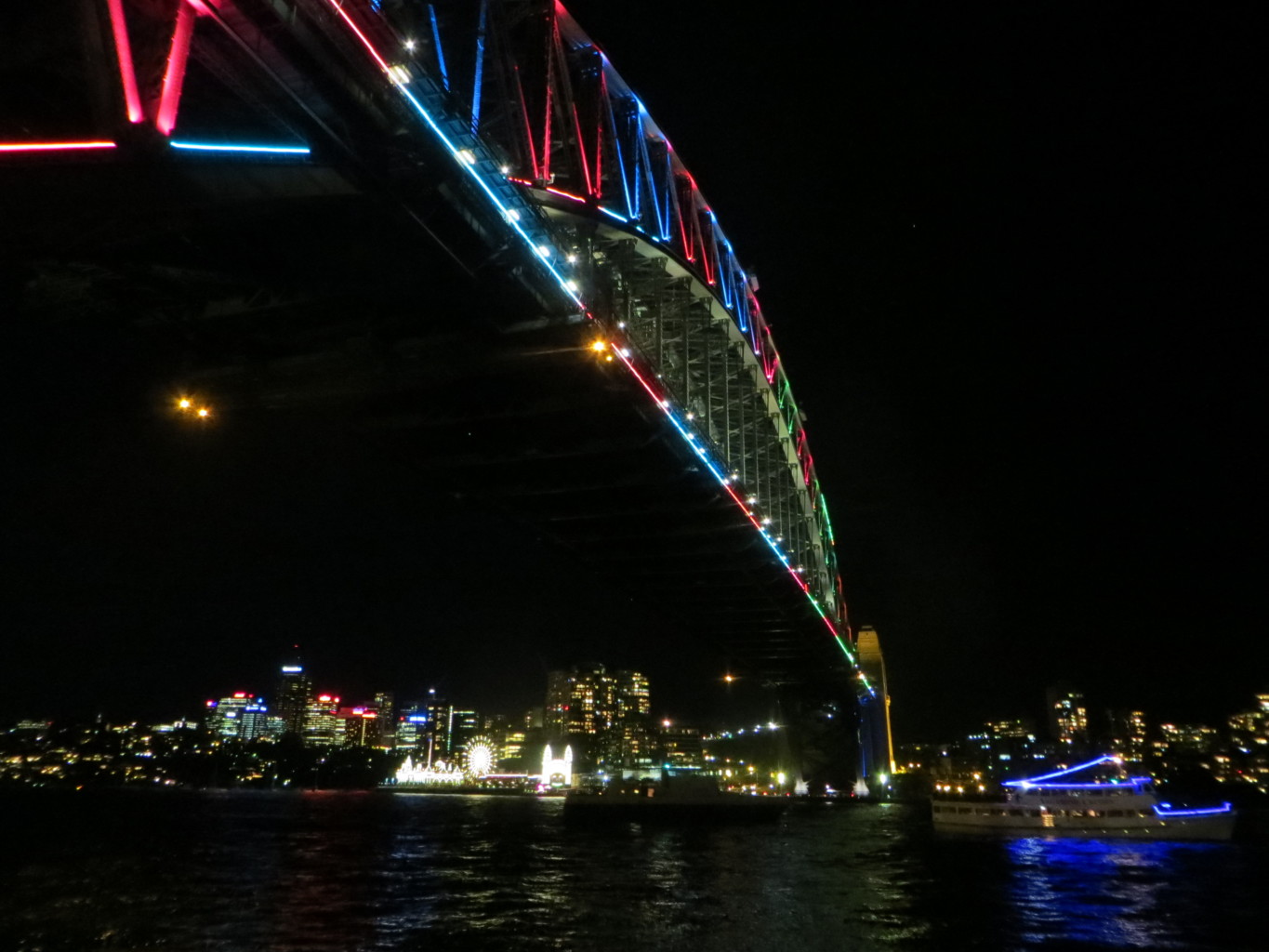 Colourful harbour bridge lit up for Vivid